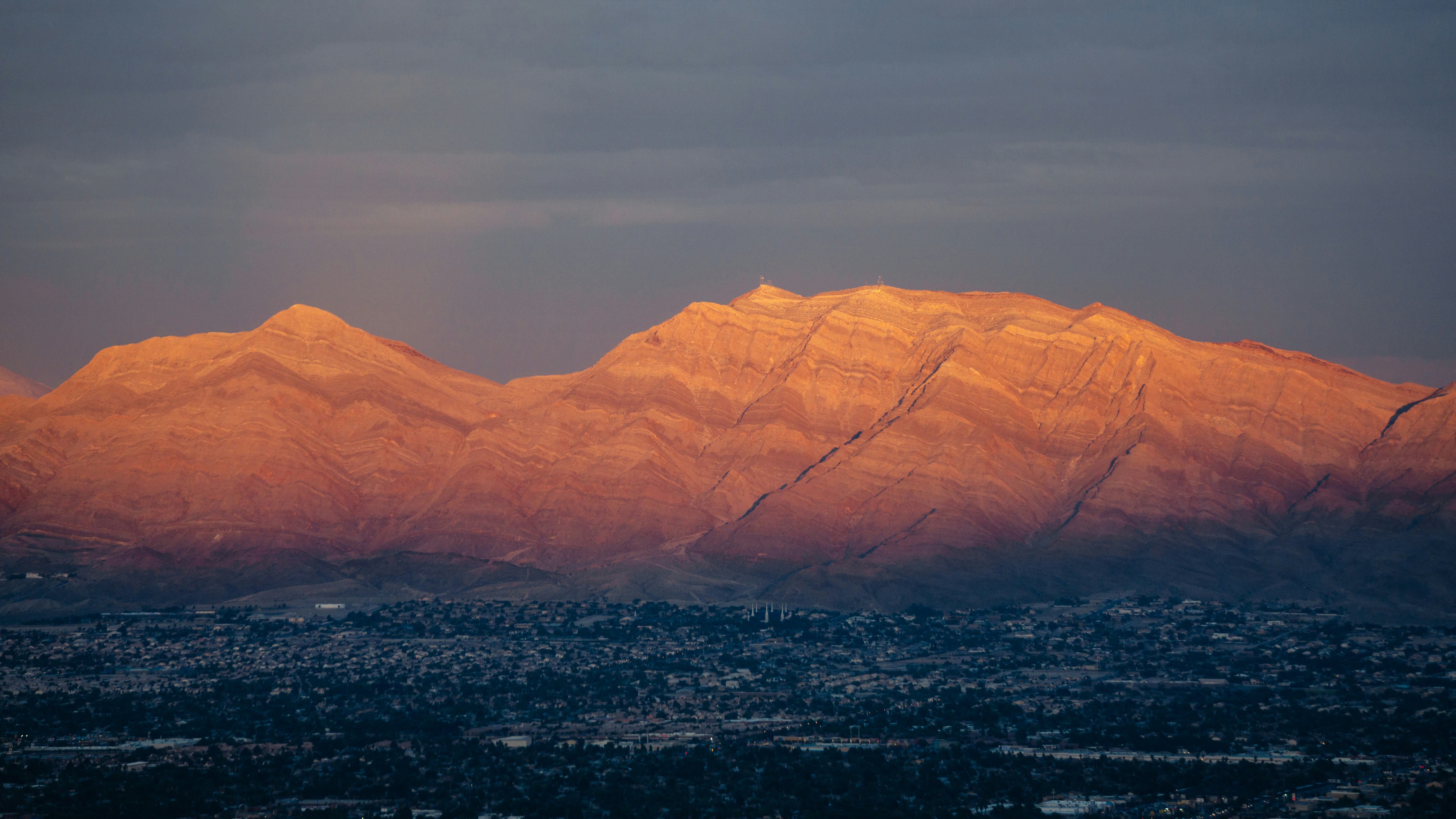 Las Vegas Valley skyline with desert mountains at golden hour, Nevada real estate
